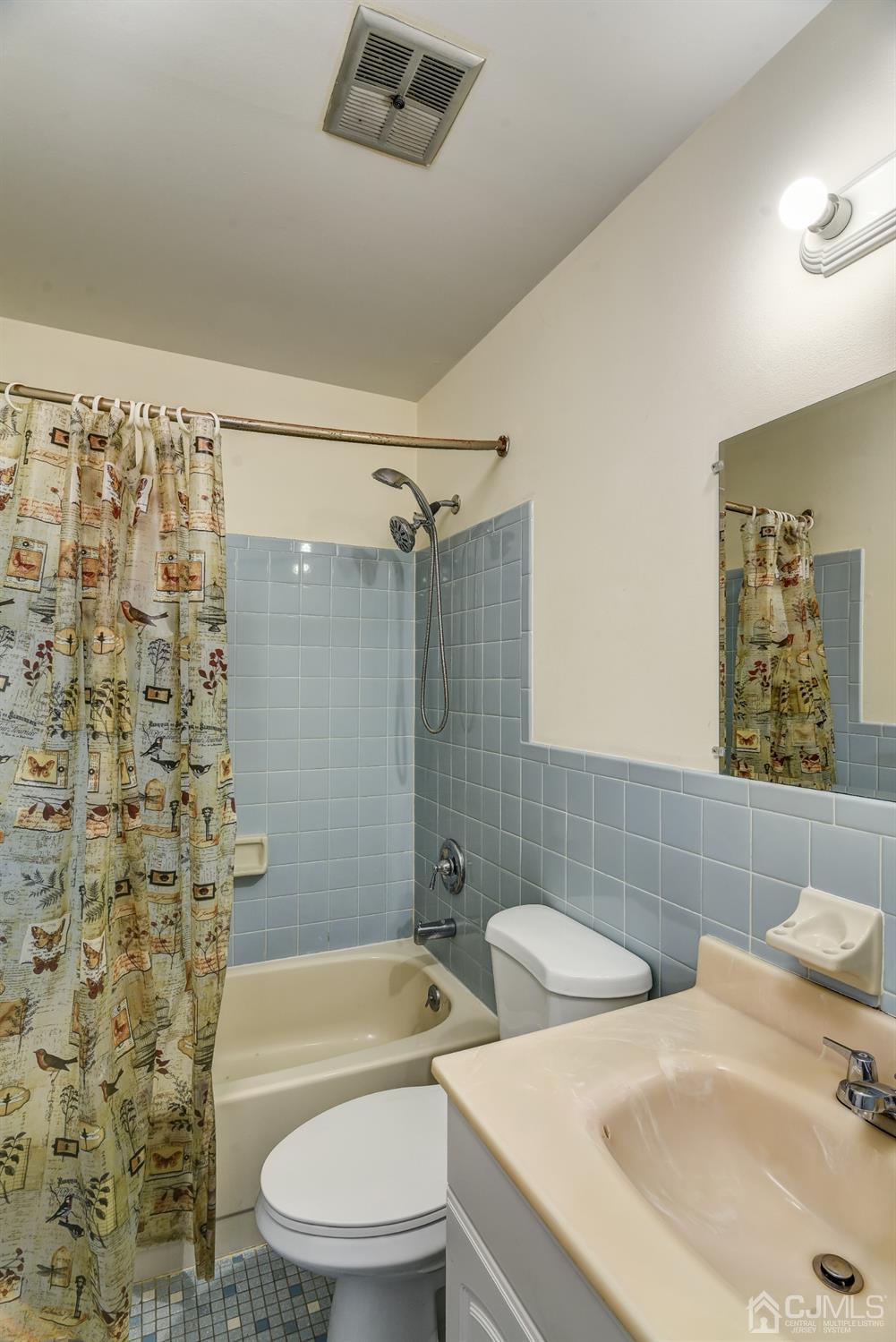 6902 Hana Road Edison, NJ 08817 - Photo 14 of 24 a bathroom with a sink toilet and shower