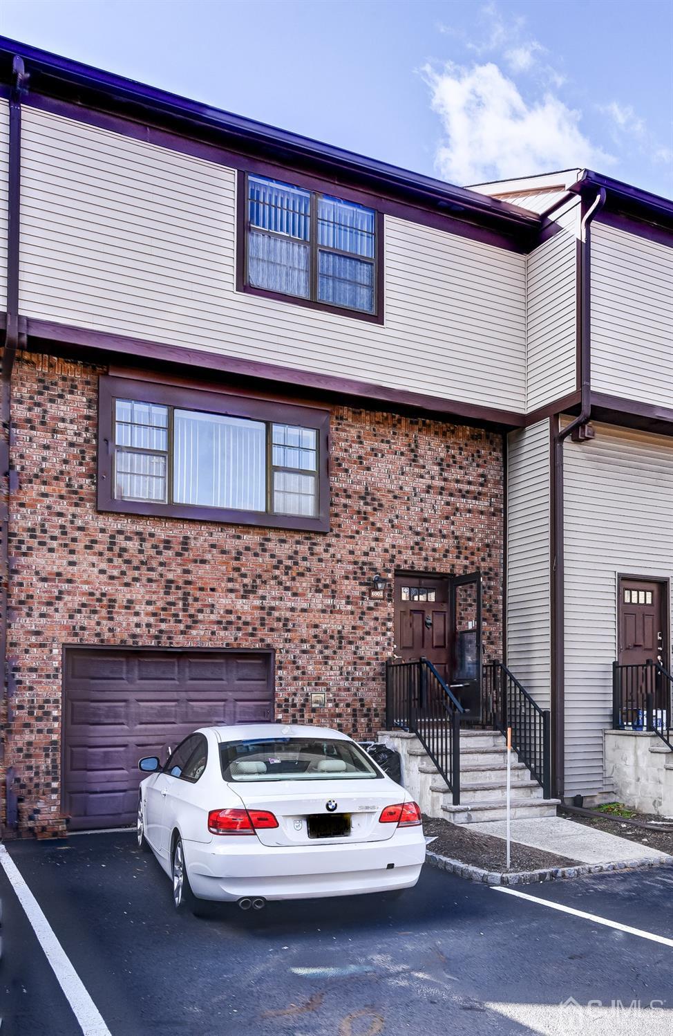 6902 Hana Road Edison, NJ 08817 - Photo 23 of 24 a white building with a white roof