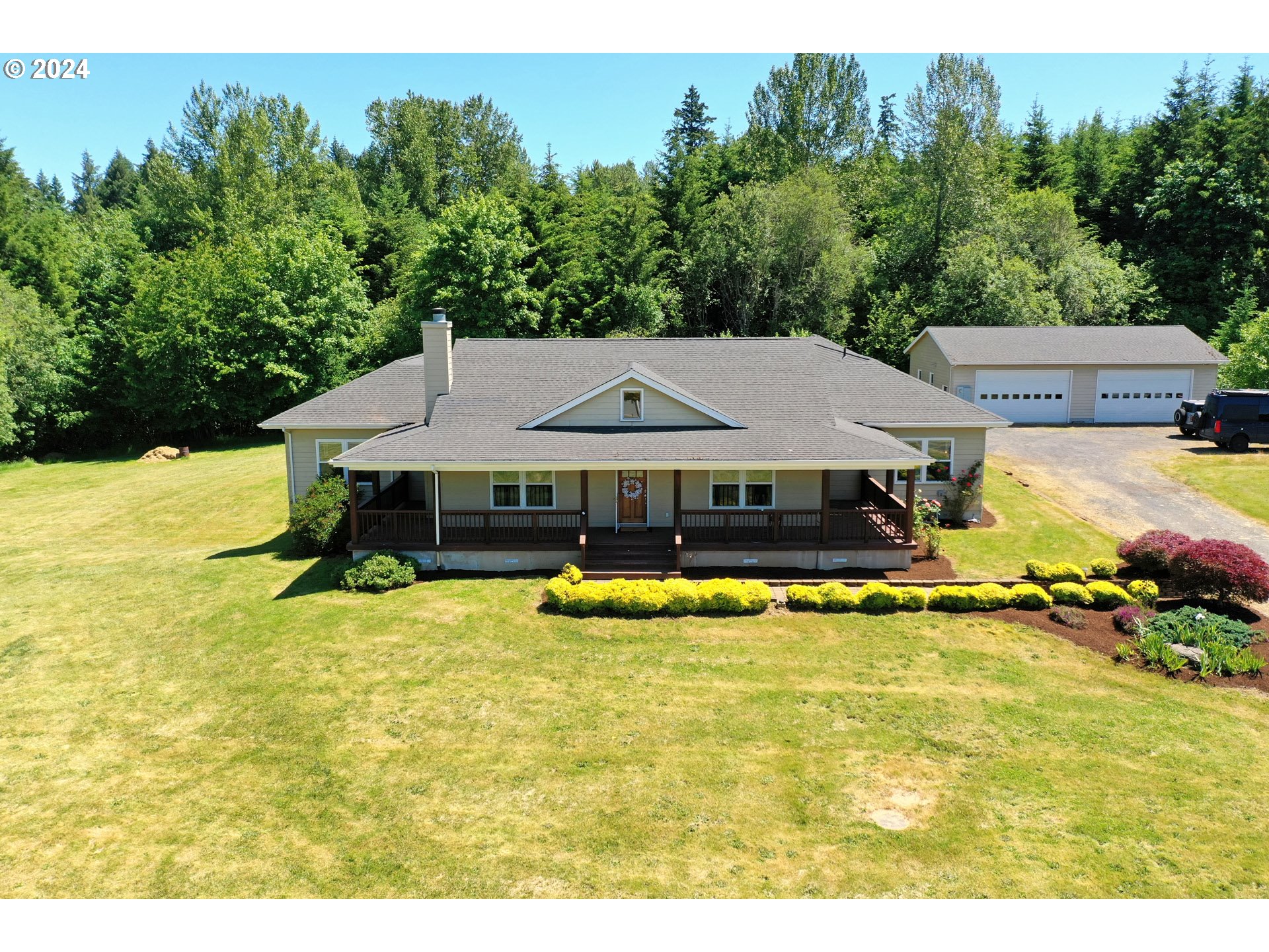 16650 Southwest Midway Road Hillsboro, OR 97123 - Photo 1 of 34 a aerial view of a house with swimming pool and big yard