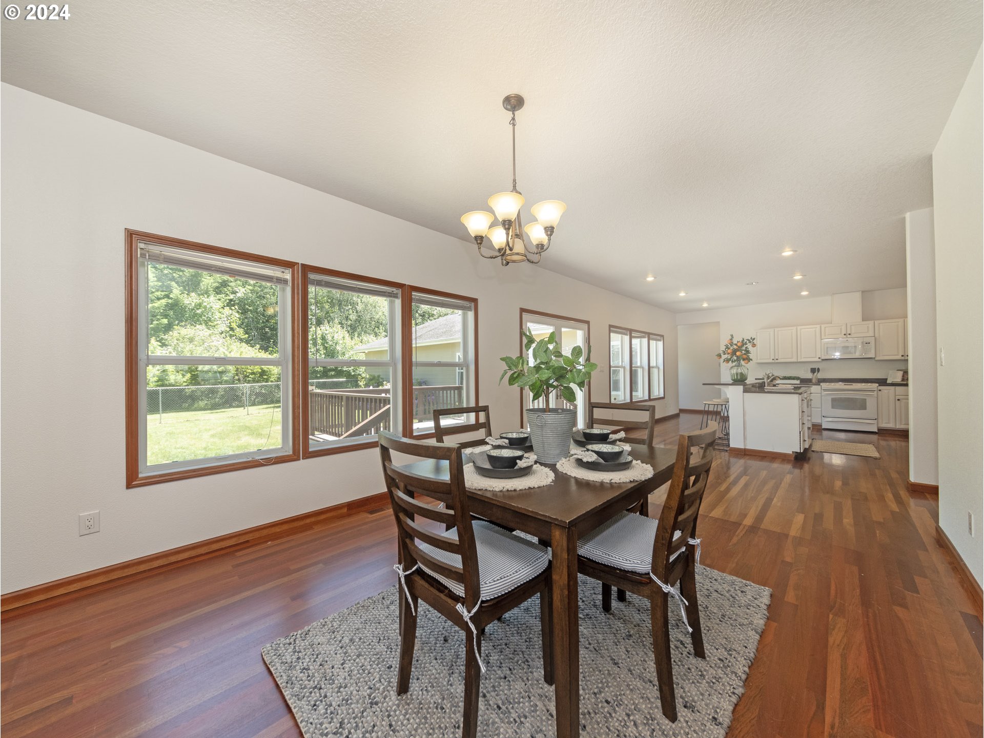 16650 Southwest Midway Road Hillsboro, OR 97123 - Photo 8 of 34 a view of a dining room with furniture wooden floor and chandelier