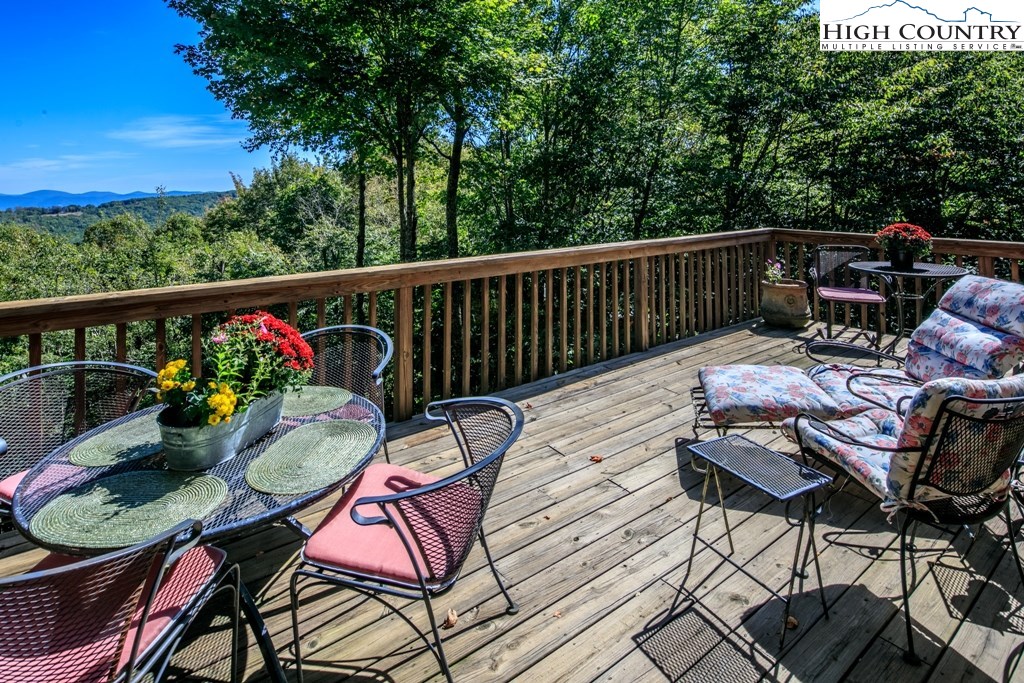 304 Lakeledge Road Beech Mountain, NC 28604 - Photo 11 of 42 a view of a chairs and table on the balcony