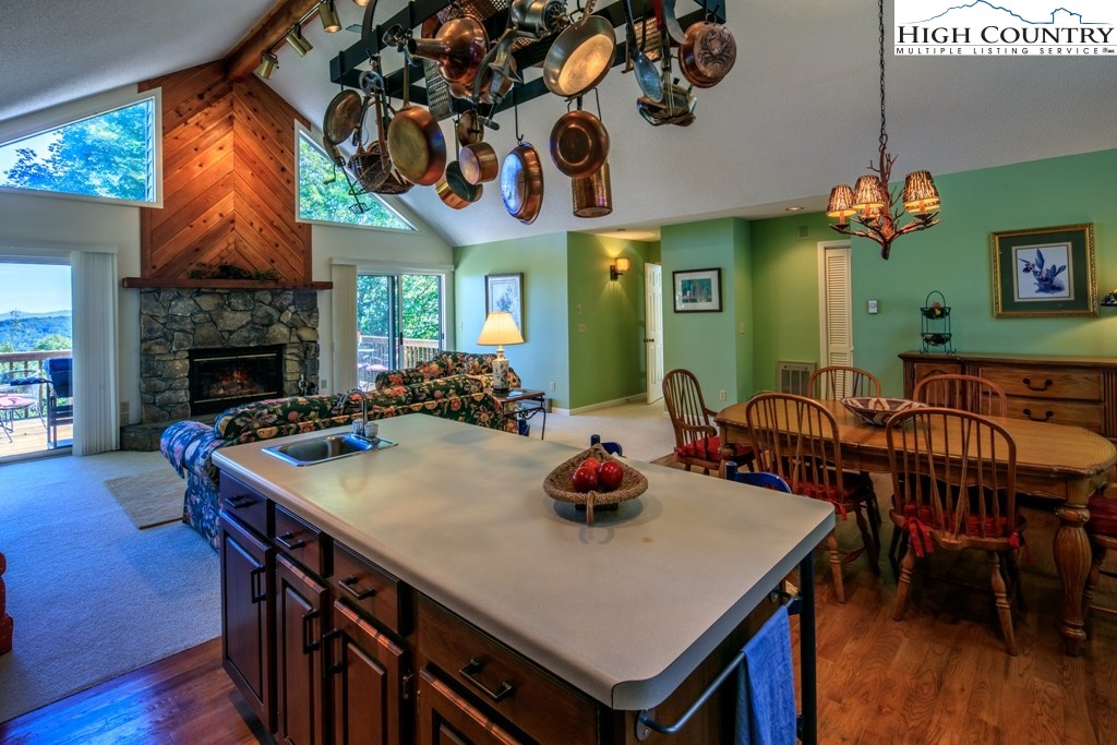 304 Lakeledge Road Beech Mountain, NC 28604 - Photo 15 of 42 a view of a dining room with furniture and wooden floor