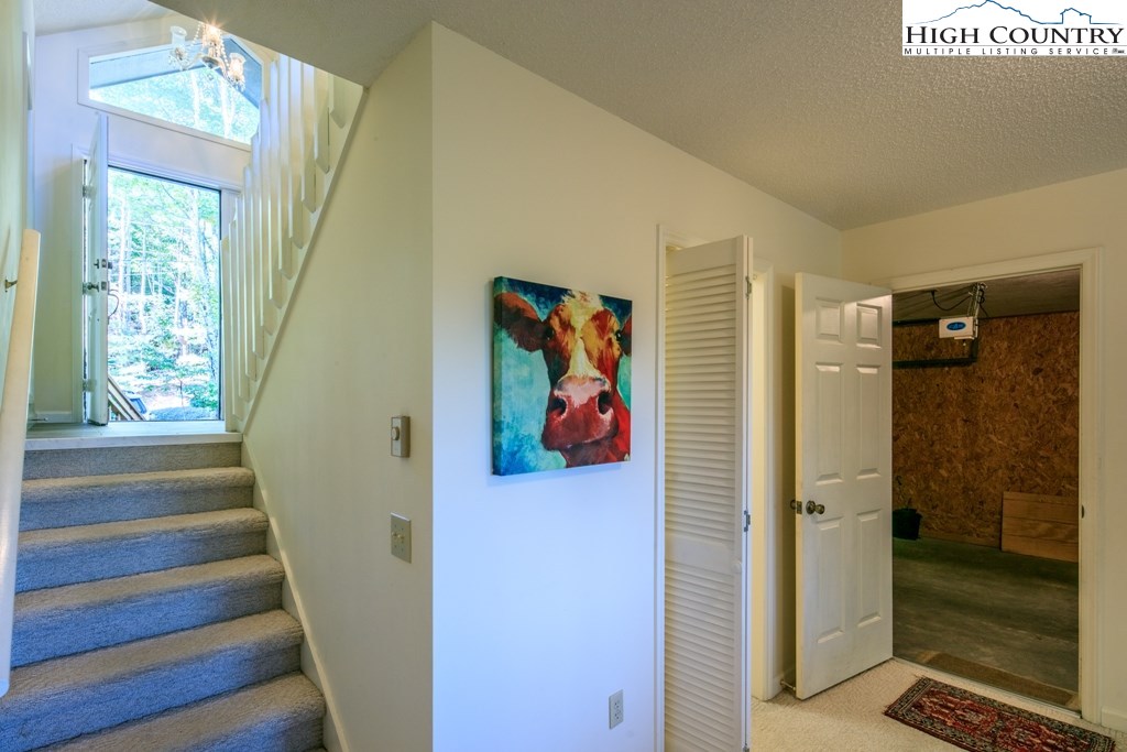 304 Lakeledge Road Beech Mountain, NC 28604 - Photo 24 of 42 a view of a hallway with wooden floor and windows
