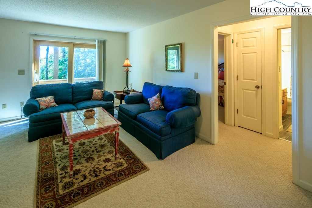 304 Lakeledge Road Beech Mountain, NC 28604 - Photo 27 of 42 a living room with furniture and a window