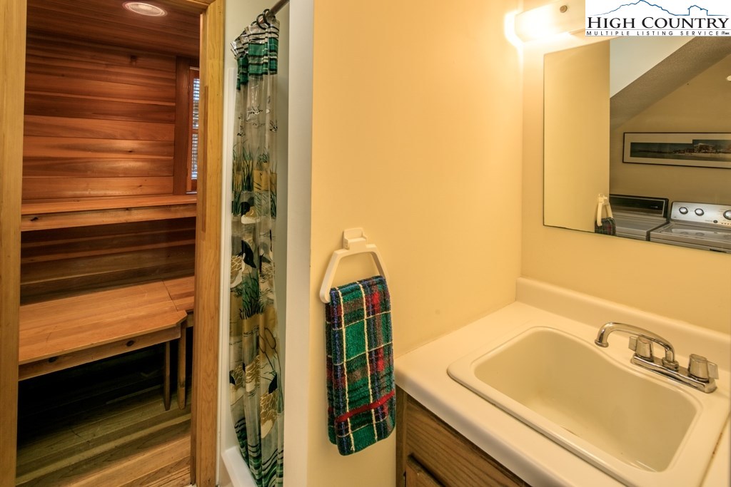 304 Lakeledge Road Beech Mountain, NC 28604 - Photo 32 of 42 a bathroom with a sink and a mirror