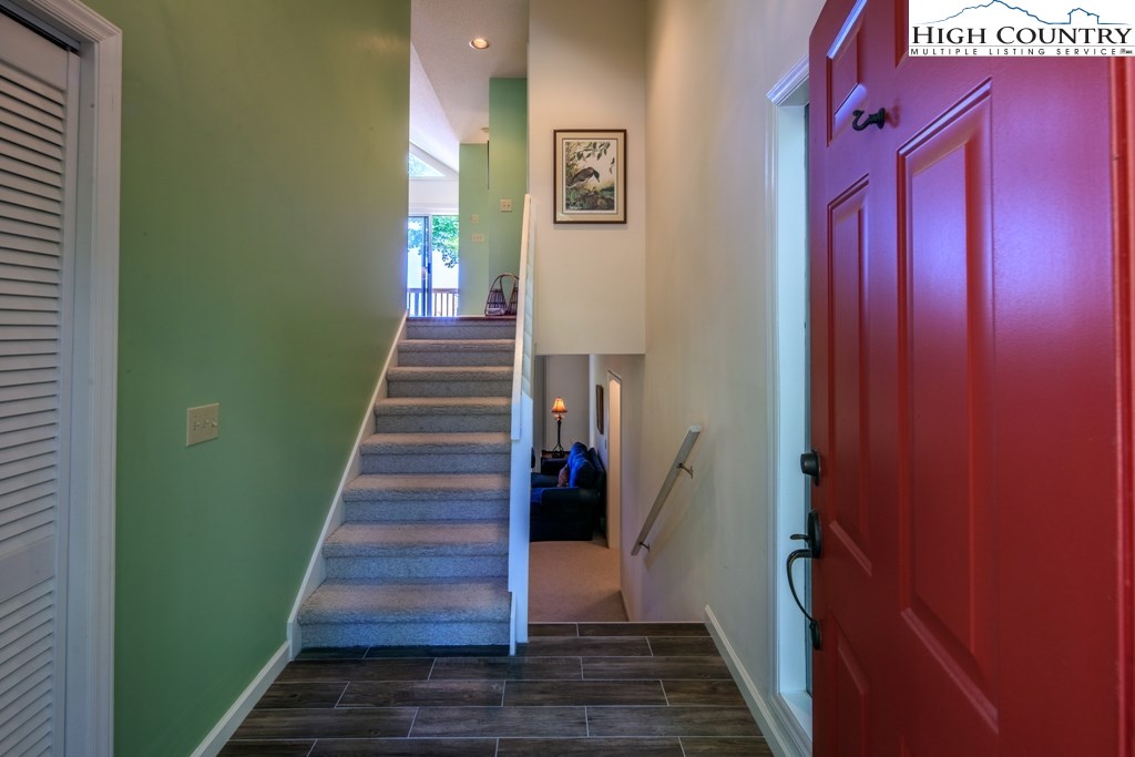 304 Lakeledge Road Beech Mountain, NC 28604 - Photo 6 of 42 a view of a hallway with wooden floor and entryway