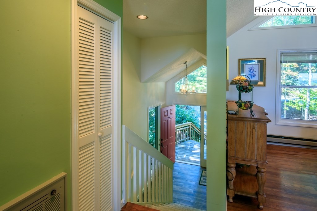 304 Lakeledge Road Beech Mountain, NC 28604 - Photo 7 of 42 a view of a hallway with wooden floor and windows