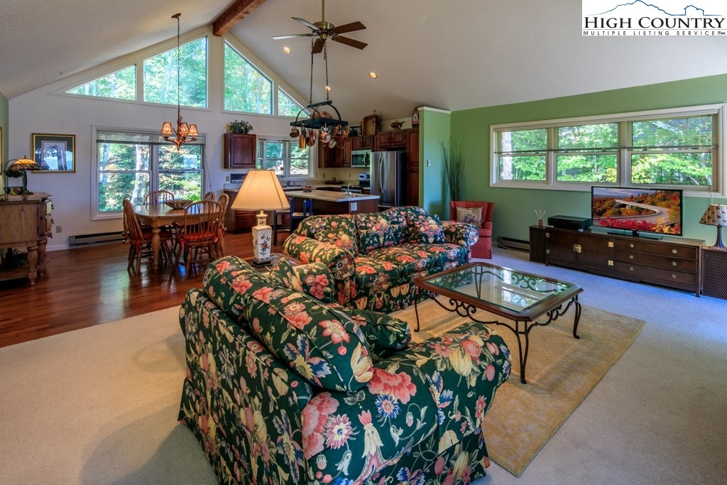 304 Lakeledge Road Beech Mountain, NC 28604 - Photo 9 of 42 a living room filled with furniture and a large window