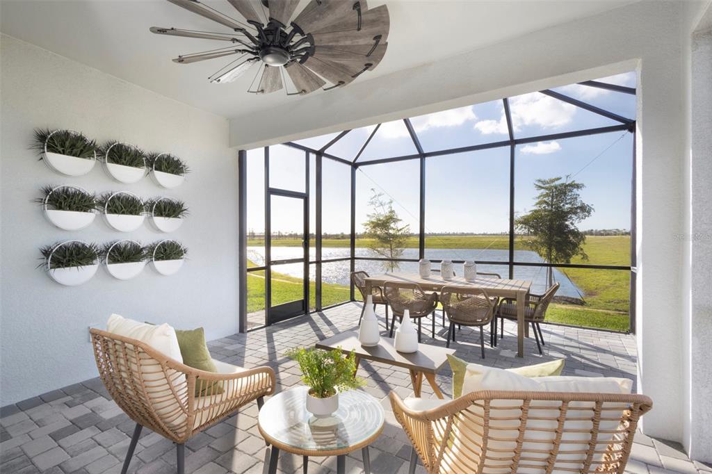 18443 Green Garden Venice, FL 34293 - Photo 8 of 40 a dining room with furniture water view and a floor to ceiling window