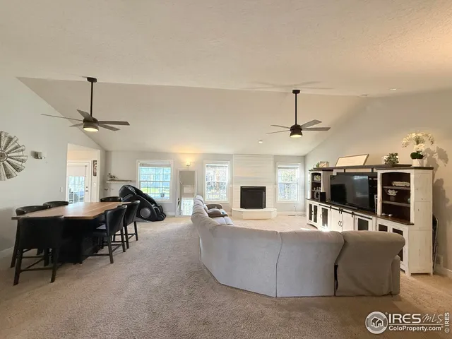 a view of a dining room with furniture and a window