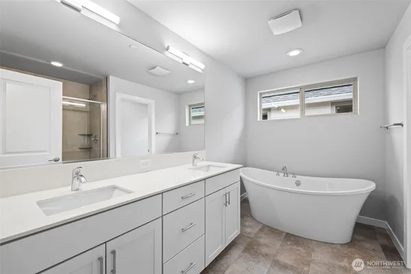a white bath tub sitting in a bathroom