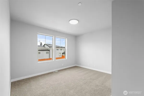 a view of storage and utility room with closet