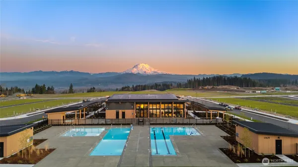a view of swimming pool with outdoor seating
