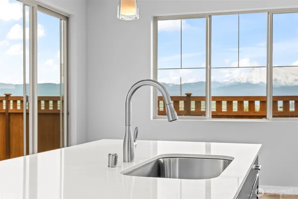 a kitchen with a sink and refrigerator