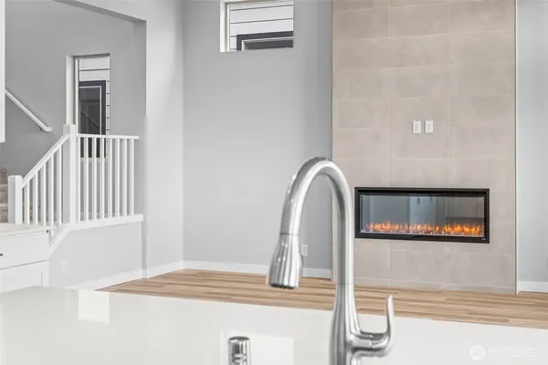 a view of a living room with a wooden floor