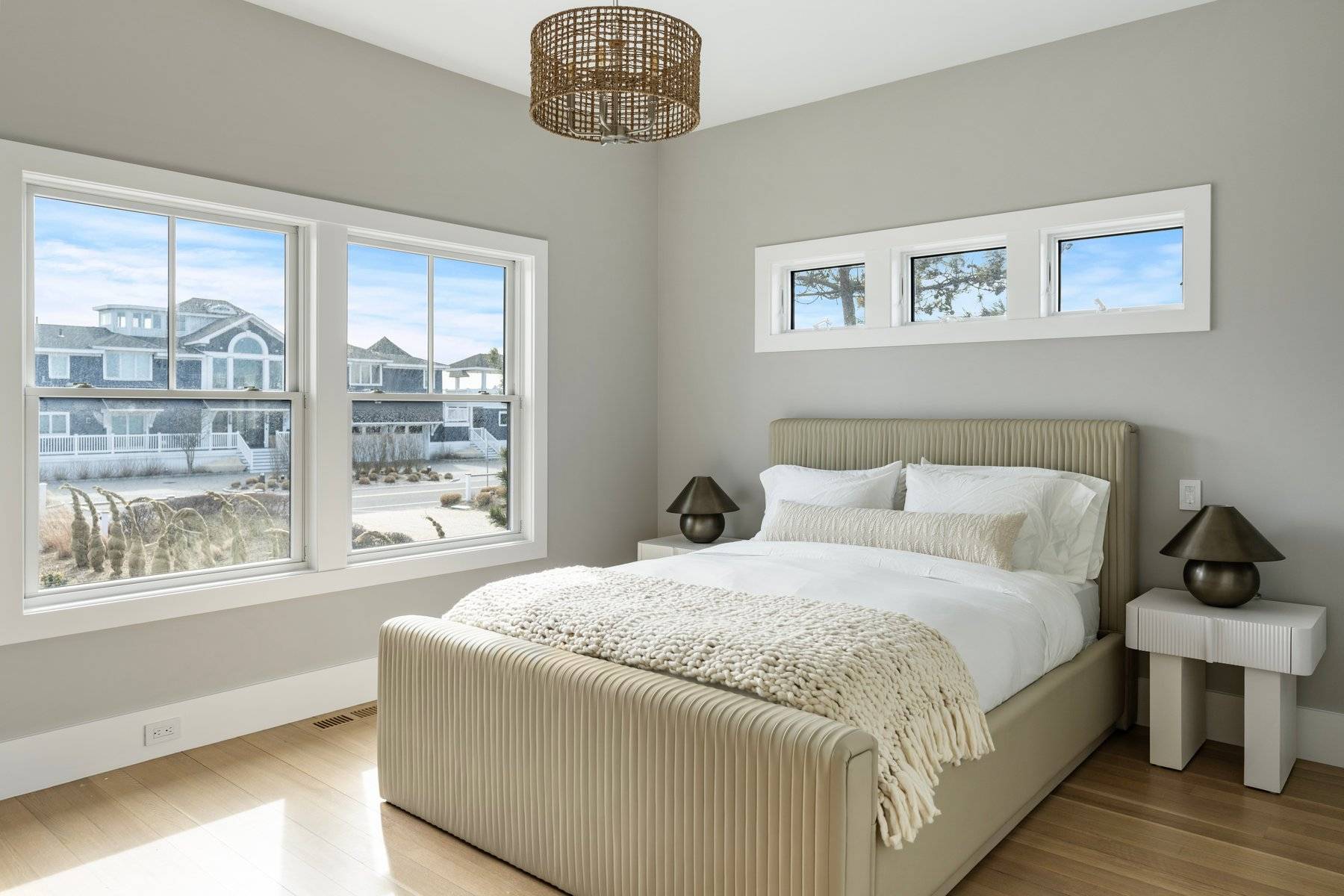 686 Dune Road Westhampton Beach, NY 11978 - Photo 14 of 37 a bedroom with a large bed and a window