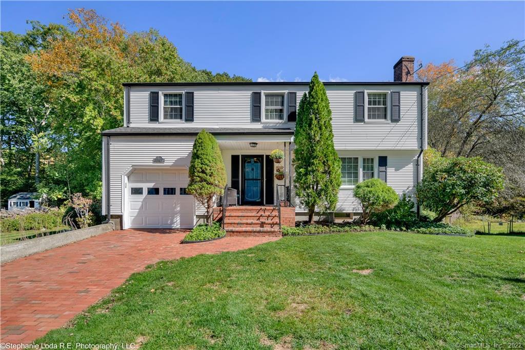 95 Valley Road Groton, CT 06340 - Photo 1 of 1 a front view of a house with a yard and garage