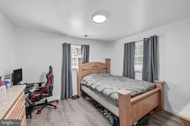 a bedroom with bed and a window