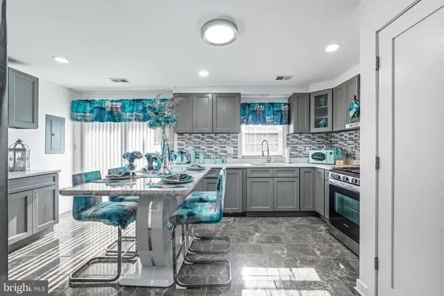 a kitchen with sink cabinets and window
