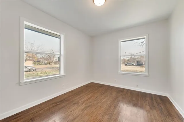 a bathroom with a bathtub sink toilet and mirror