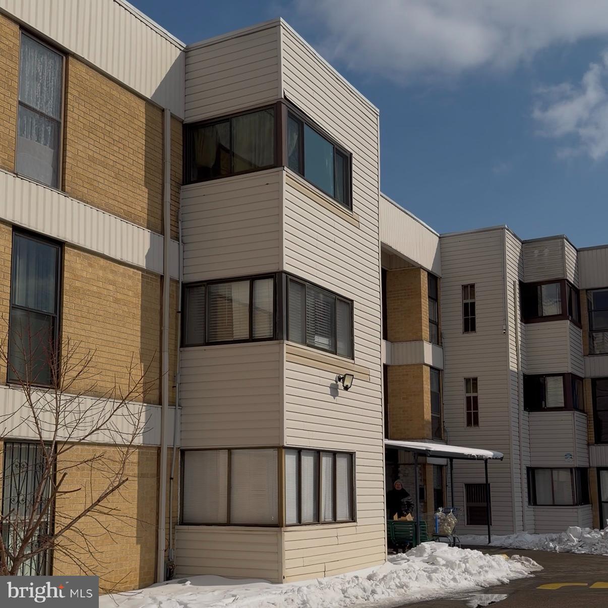 2628-00 Welsh Road, Unit 111 Philadelphia, PA 19152 - Photo 2 of 11 a front view of a house with a balcony