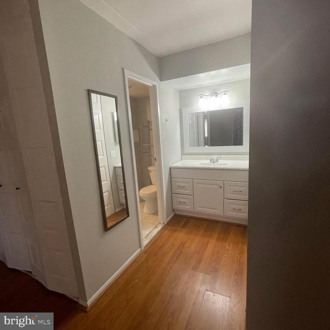 2628-00 Welsh Road, Unit 111 Philadelphia, PA 19152 - Photo 6 of 8 a view of an empty room with window and wooden floor
