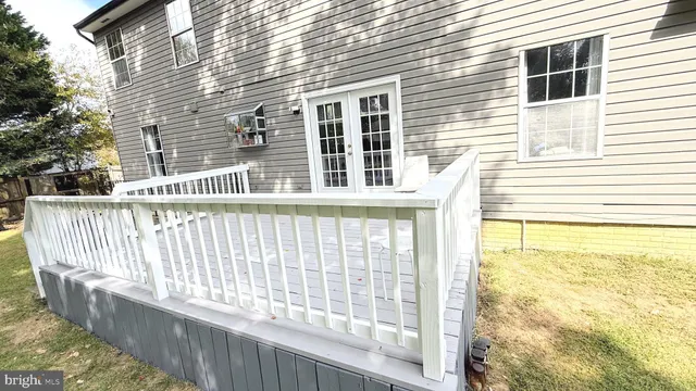 a view of a balcony with a yard