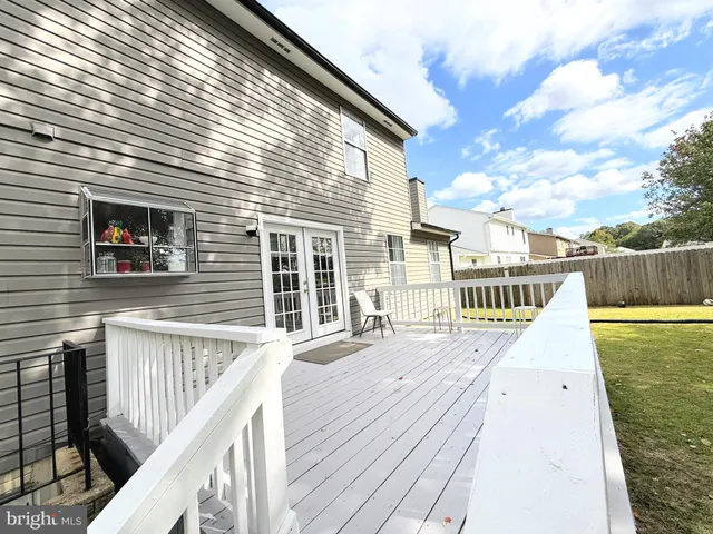 a view of a wooden deck and city view
