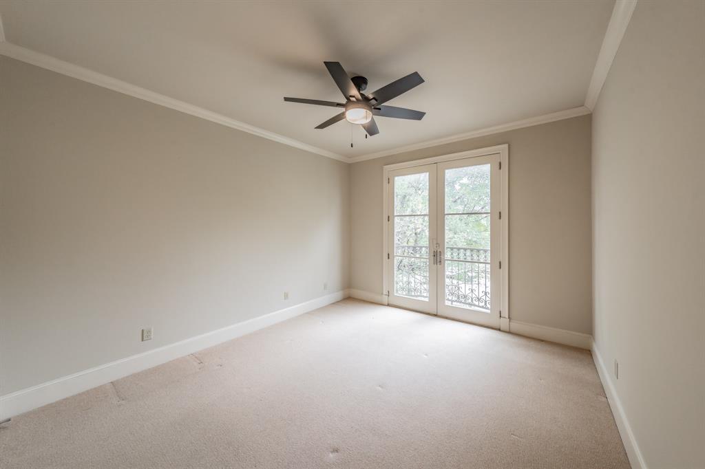 3635 Crestline Road Fort Worth, TX 76107 - Photo 17 of 40 an empty room with windows and ceiling fan