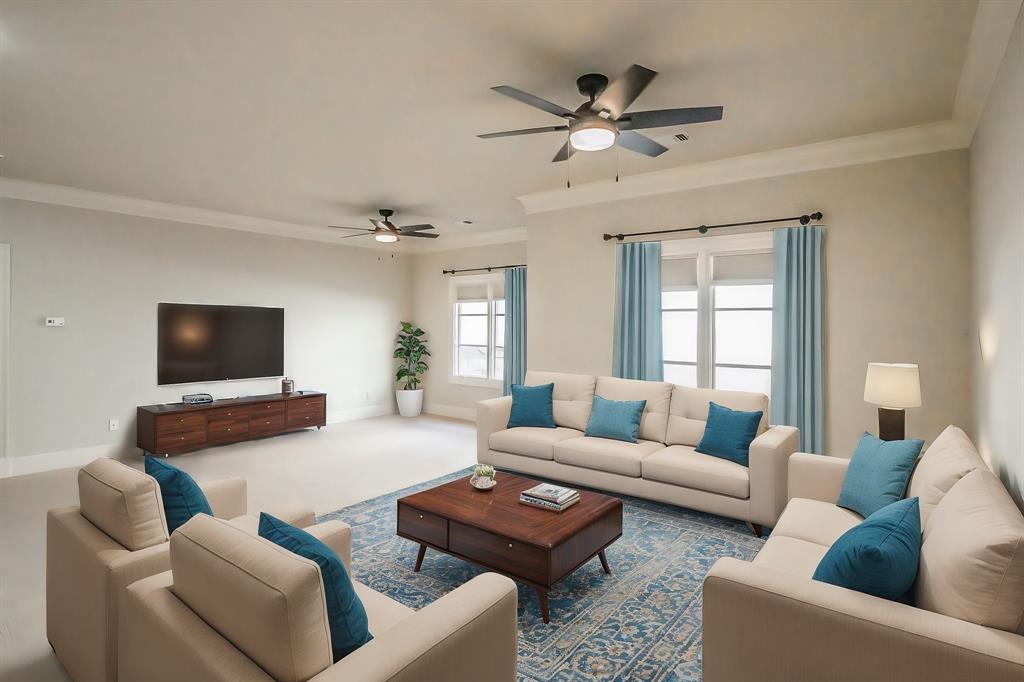 3635 Crestline Road Fort Worth, TX 76107 - Photo 22 of 40 a living room with furniture a flat screen tv and a window