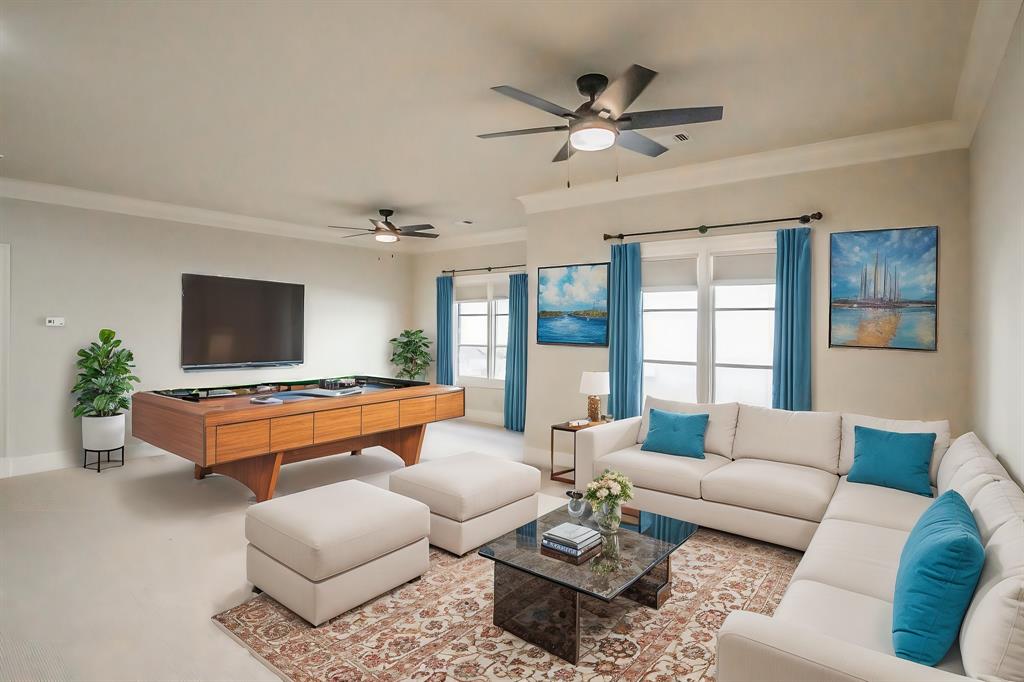 3635 Crestline Road Fort Worth, TX 76107 - Photo 23 of 40 a living room with furniture and a flat screen tv