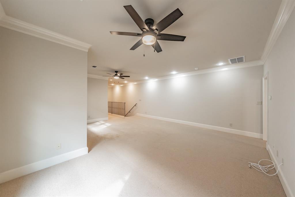 3635 Crestline Road Fort Worth, TX 76107 - Photo 26 of 40 an empty room with a ceiling fan and a window