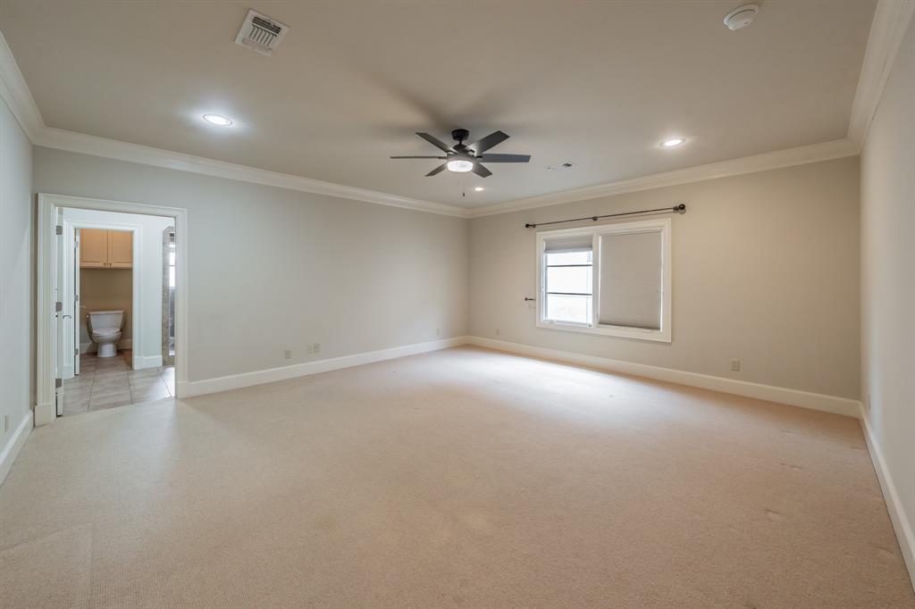 3635 Crestline Road Fort Worth, TX 76107 - Photo 29 of 40 an empty room with windows and ceiling fan