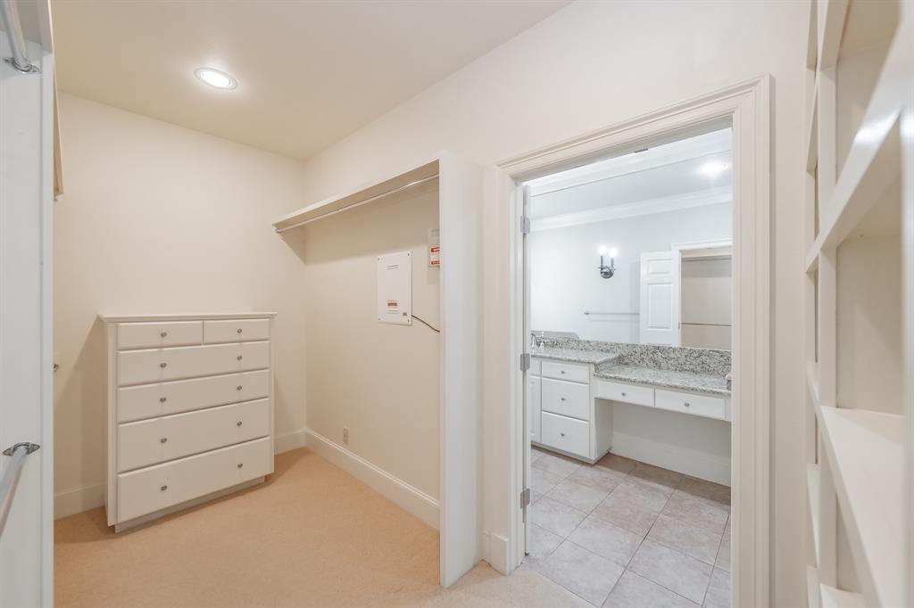 3635 Crestline Road Fort Worth, TX 76107 - Photo 36 of 40 walk in closet with a vanity and mirror