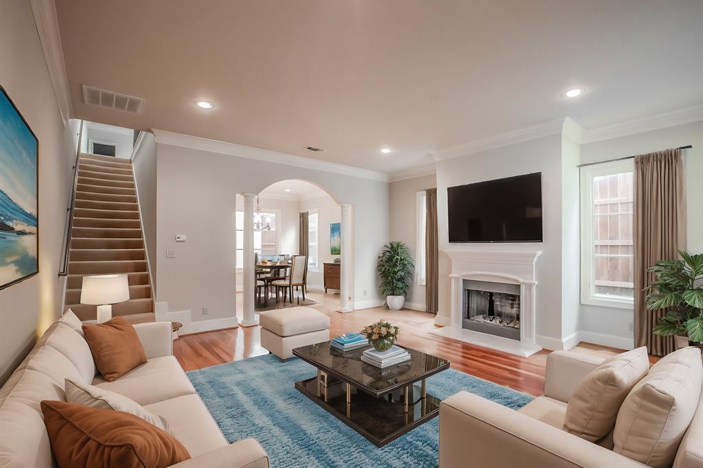 3635 Crestline Road Fort Worth, TX 76107 - Photo 4 of 40 a living room with furniture fireplace and a flat screen tv