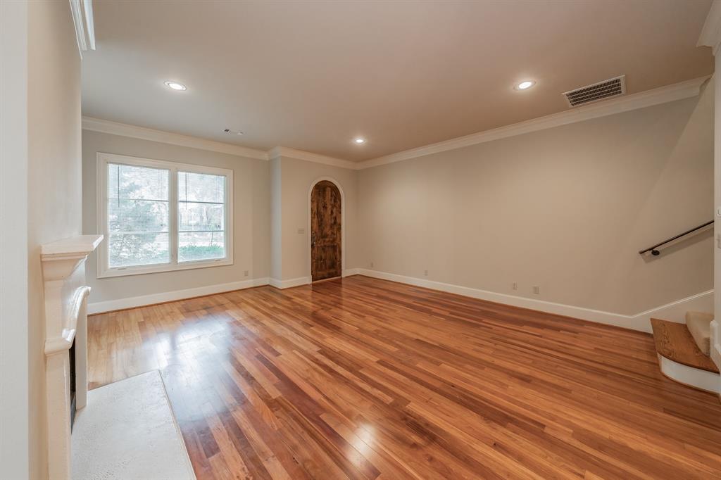 3635 Crestline Road Fort Worth, TX 76107 - Photo 5 of 40 a view of empty room with wooden floor and fan