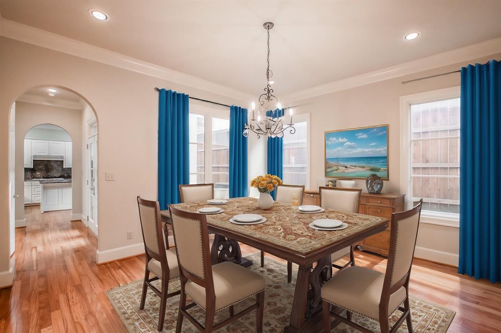 3635 Crestline Road Fort Worth, TX 76107 - Photo 8 of 40 a view of a dining room with furniture window and wooden floor
