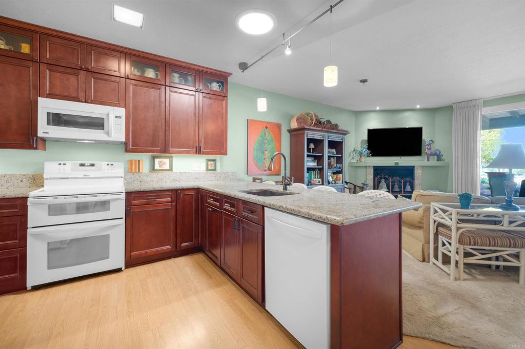 202 Pointing Rock Drive, Unit 6 Borrego Springs, CA 92004 - Photo 13 of 28 a kitchen with a sink stove and oven