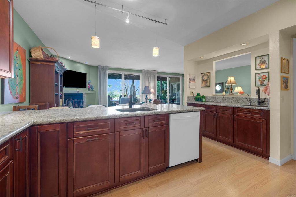 202 Pointing Rock Drive, Unit 6 Borrego Springs, CA 92004 - Photo 14 of 28 a kitchen with a sink and a large mirror