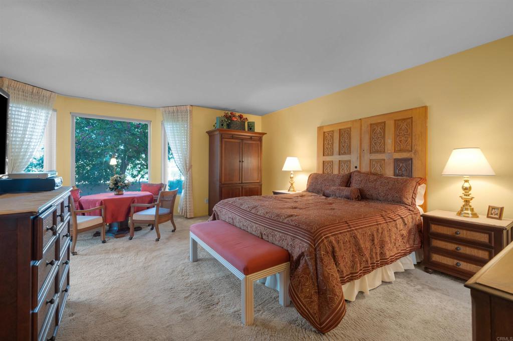 202 Pointing Rock Drive, Unit 6 Borrego Springs, CA 92004 - Photo 17 of 28 a bedroom with a bed and a couch