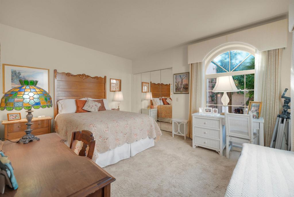 202 Pointing Rock Drive, Unit 6 Borrego Springs, CA 92004 - Photo 22 of 28 a spacious bedroom with a bed and large windows