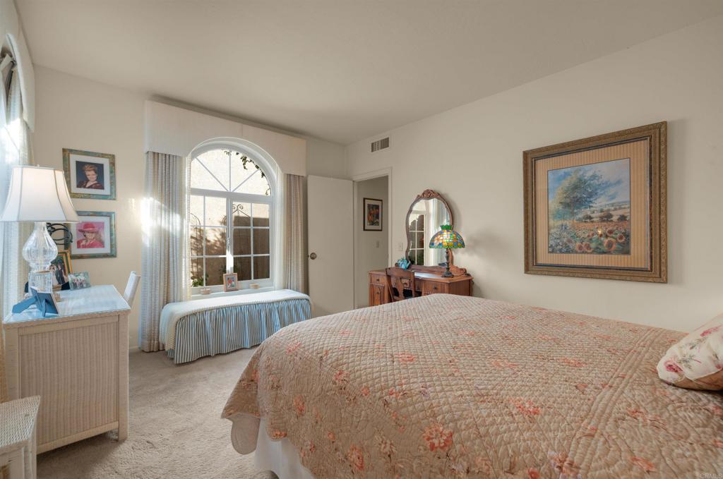 202 Pointing Rock Drive, Unit 6 Borrego Springs, CA 92004 - Photo 23 of 28 a large bedroom with a bed and a large window