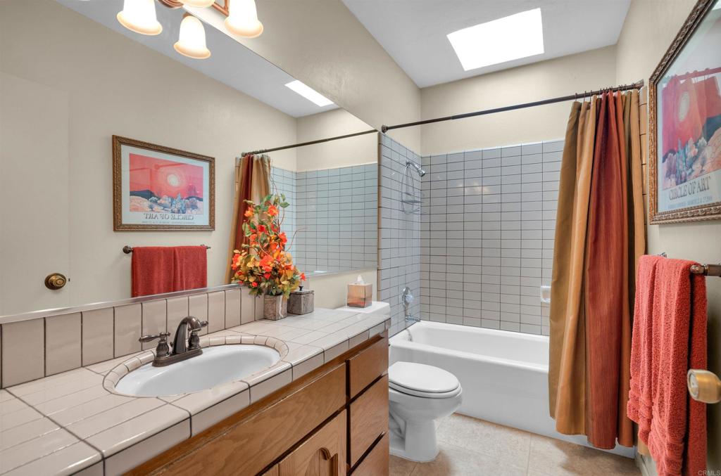 202 Pointing Rock Drive, Unit 6 Borrego Springs, CA 92004 - Photo 24 of 28 a bathroom with a granite countertop sink toilet and shower