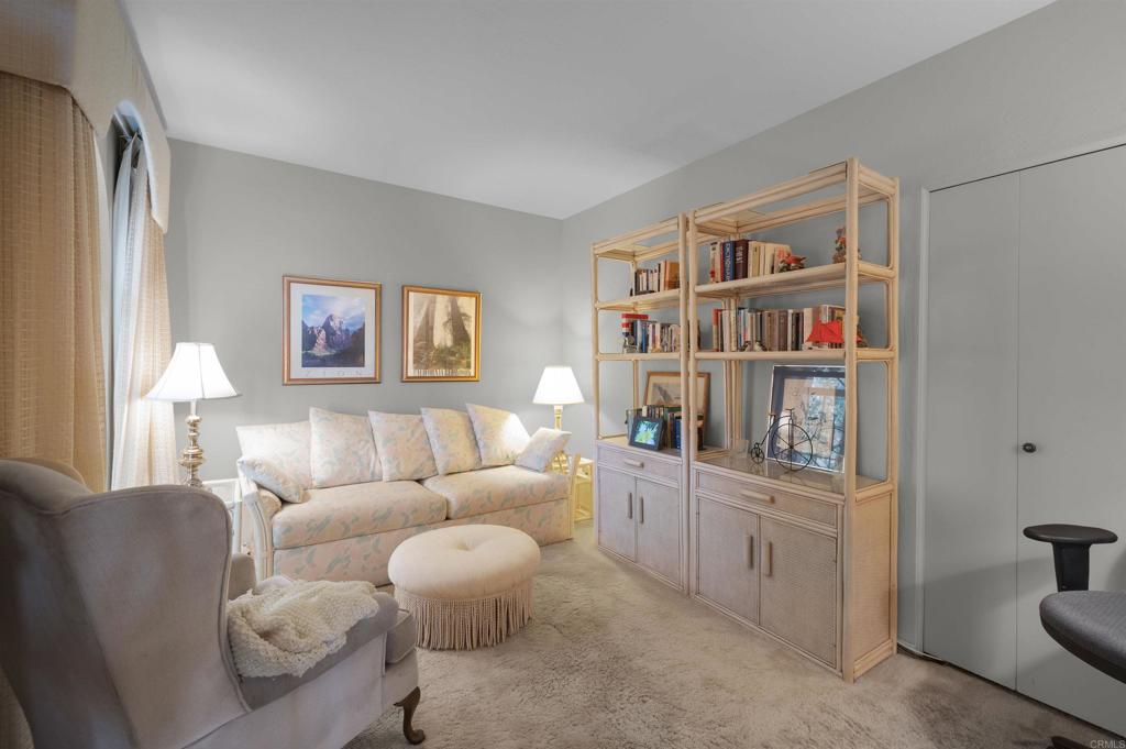 202 Pointing Rock Drive, Unit 6 Borrego Springs, CA 92004 - Photo 25 of 28 a living room with furniture and a book shelf