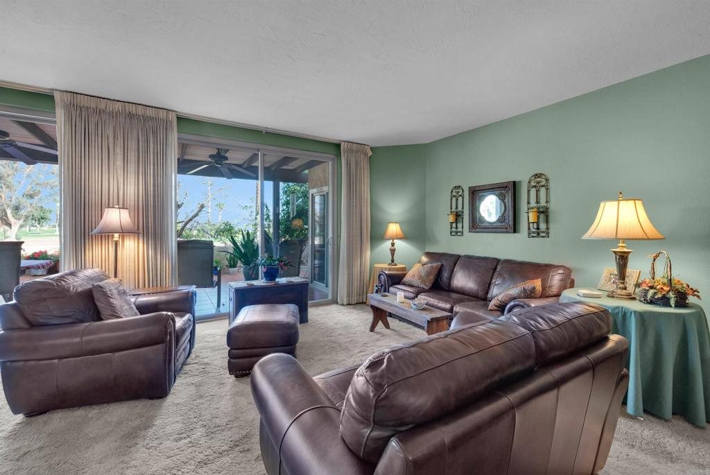 202 Pointing Rock Drive, Unit 6 Borrego Springs, CA 92004 - Photo 8 of 28 a living room with furniture and a large window
