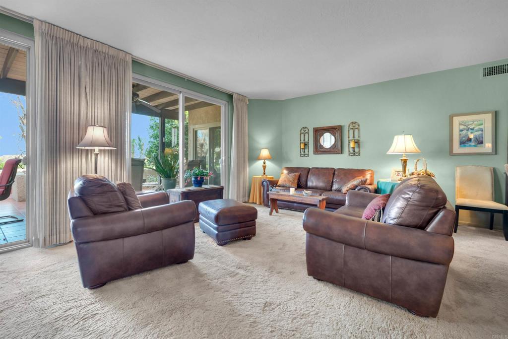 202 Pointing Rock Drive, Unit 6 Borrego Springs, CA 92004 - Photo 10 of 28 a living room with furniture and a large window