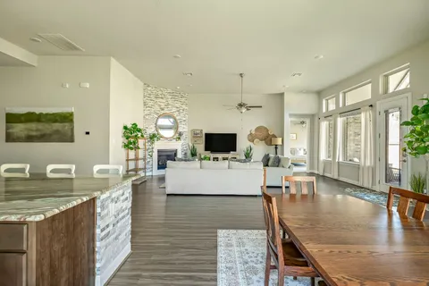a living room with fireplace furniture and a flat screen tv