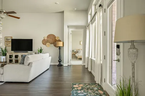 a spacious bedroom with a bed and a couch