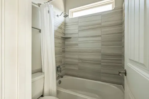 a view of a chair in backyard of house