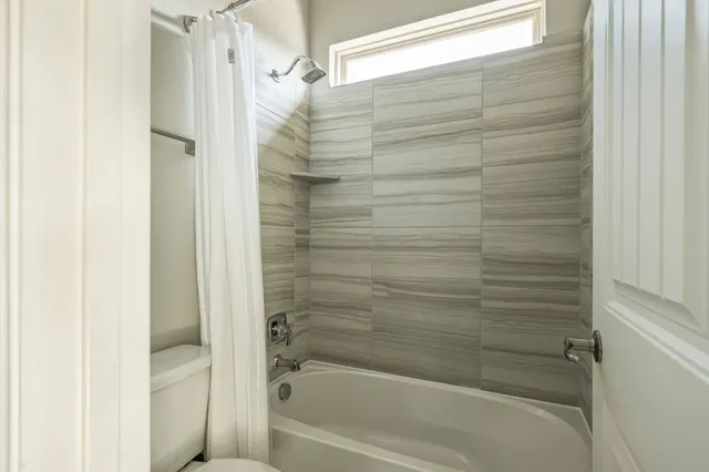 a view of a chair in backyard of house